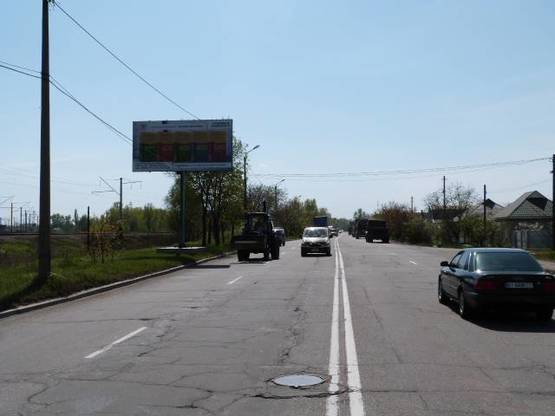 Фото рекламной плоскости по адресу ул. Железнодорожная, 49, район Кондитерской фабрики «Лукас», направлене в центр