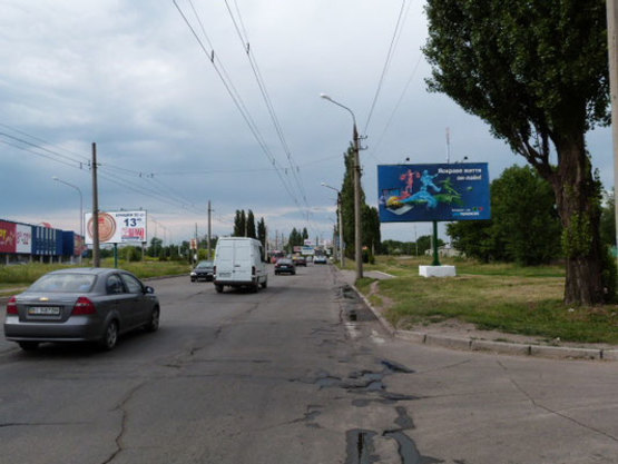 Фото рекламной плоскости по адресу просп. Л.Украинки (просп. 50-лет. Октября), 22, возле кафе «Молодёжный квартал», напротив гипермаркета «Велмарт»