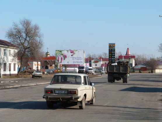 Фото рекламной плоскости по адресу переулок Медовый (переулок Постышева), 213, район АЗС и Кондитерской фабрики «Лукас»