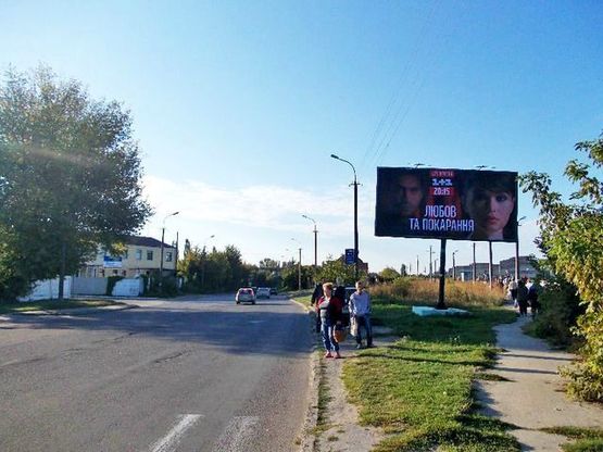 Фото рекламной плоскости по адресу Карпенко-Карого ул. 100 м. к ул.Устилужской в центр