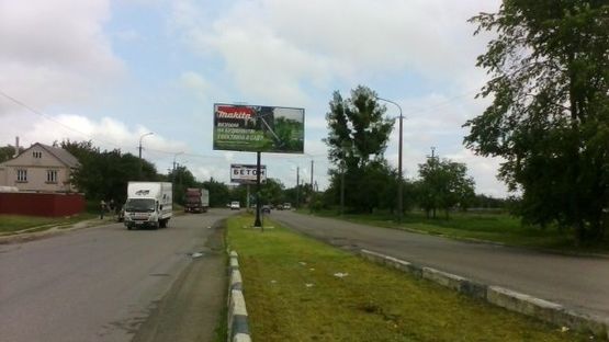 Фото рекламной плоскости по адресу Карпенко-Карого ул., мост (разделитель)