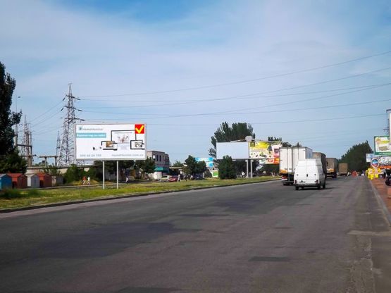 Фото рекламной плоскости по адресу Донецьке шосе, за ринком "Березинський", з центру/Донецкое шоссе, за рынком "Березинский", из центра, перед поворотом к ТЦ Караван