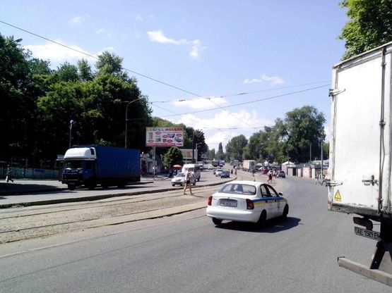 Фото рекламной плоскости по адресу пр.Івана Мазепи, маг.АТБ, навпроти маг.ПІК, базар, до центру/пр.Петровского, маг.АТБ, напротив маг.ПИК, базар, из центра
