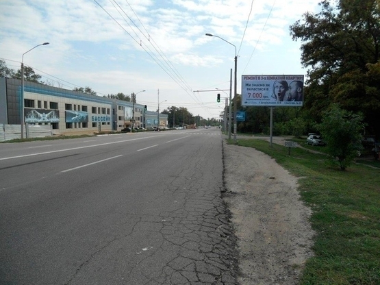 Фото рекламной плоскости по адресу вул. Запорізьке шосе, 74, виїзд з міста, світлофор/ул. Запорожское шоссе, 74, выезд из города, светофор