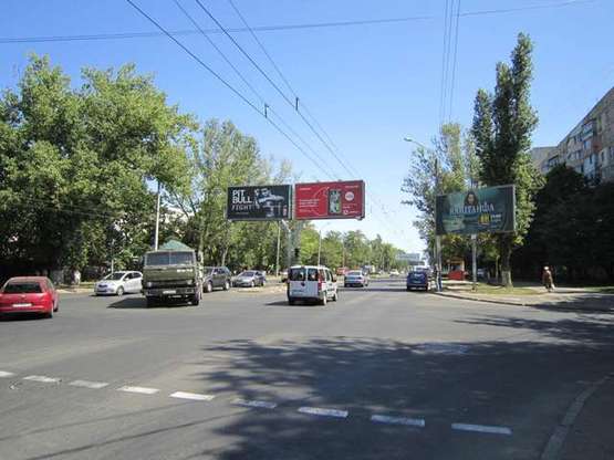 Фото рекламної площини за адресою пр-т Ак.Глушко, 25 - ул. Ильфа и Петрова Чебурашка (на МакДональдс)