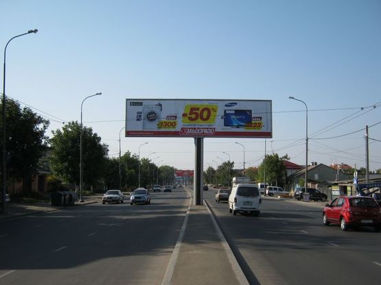 Фото рекламной плоскости по адресу ул. Щорса - ул. Корнюшина (левая из города)