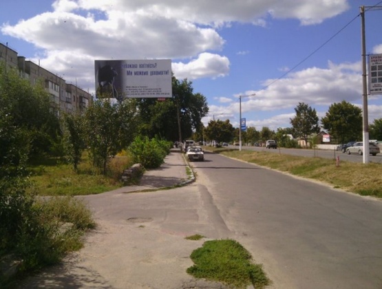 Фото рекламної площини за адресою Коростишів в. Більшовицька 103 (ГУСЬ), центральна вулиця, напрямок з Києва на Житомир, напроти с/м "ФУРШЕТ",ст.Б