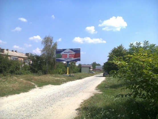 Фото рекламної площини за адресою Коростишів в. Більшовицька 96, центральна вулиця, напрямок з Житомира на Київ, ст Б
