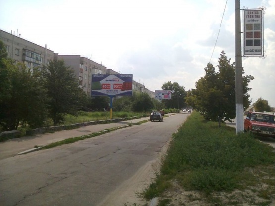 Фото рекламної площини за адресою Коростишів в. Більшовицька 103, центральна вулиця, напрямок з Києва на Житомир, напроти с/м "ФУРШЕТ",ст.Б