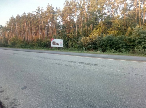 Фото рекламной плоскости по адресу Траса Житомир-Бердичів, с.Пряжево. За комплексом "Русалка", напрямок з Житомира на Бердичів,Вінницю, ст.А