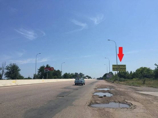 Фото рекламной плоскости по адресу Киевское шоссе - пос. Нерубайское  - выезд с АЗС WOG
