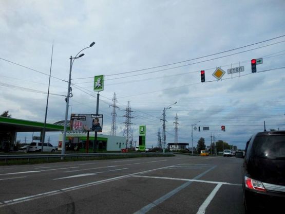 Фото рекламної площини за адресою Траса "Київ-Іванків-Овруч", Р-02 км 20+250 ліво, АЗС ''ОККО'', АЗС ''БРСМ'', поворот на вул. Шолуденка