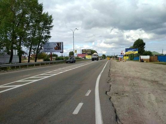 Фото рекламной плоскости по адресу Траса "Київ-Іванків-Овруч", Р-02 км 20+920 ліво, с. Нові Петрівці