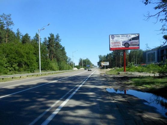 Фото рекламної площини за адресою Траса "Київ-Іванків-Овруч",  Р-02 км 19+300 право, поворот на завод SANDORA, HENKEL-Україна, перед КПП "Нові Петрівці"