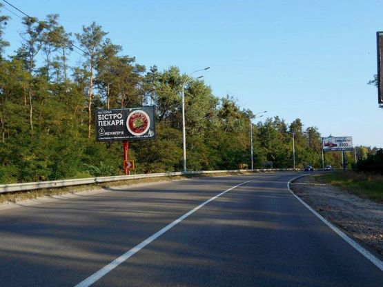 Фото рекламної площини за адресою Траса "Київ-Іванків-Овруч", Р-02 км 19+ 050 ліво, 400 м. до завода SANDORA, 700 м до КПП, на c. Нові Петрівці