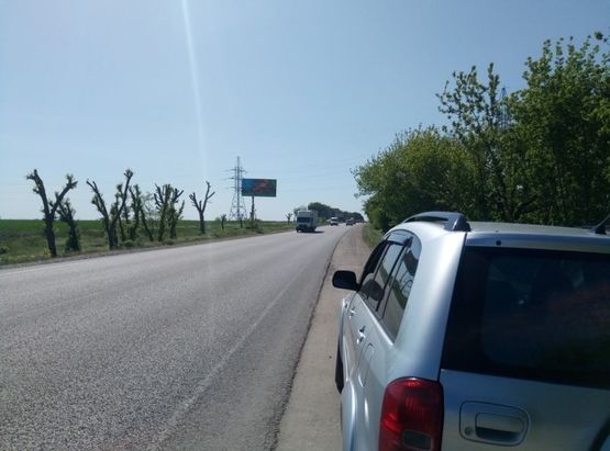 Фото рекламной плоскости по адресу Одесса-Рени 12+450 Б ( в стор. Рени с 2 столбов)