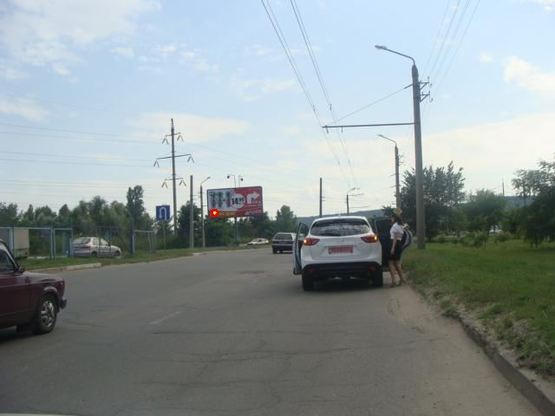 Фото рекламной плоскости по адресу Миру просп. (автостоянка)(з центру)