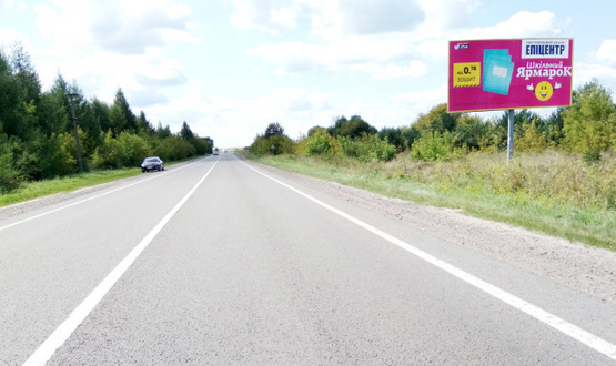 Фото рекламной плоскости по адресу выезд с г.Радехов в направлении г.Львова, г.Каменка-Бугская, трасса Львов-Луцк (Н-17) + АЗК + жовта вітрозахисна люмінесцентна рамка + висока конструкція