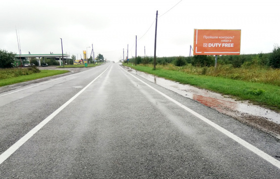 Фото рекламної площини за адресою таможня, на границу с Польшей, трасса Львов- Рава-Русская (М-09) + АЗС + жовта вітрозахисна люмінесцентна рамка