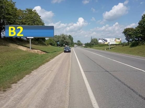 Фото рекламної площини за адресою М-06 Київ-Чоп, за поворотом на Тернопіль і в сторону Києва (лівий)