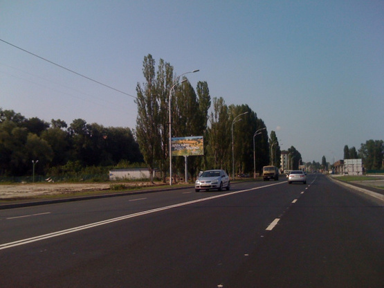 Фото рекламної площини за адресою Набережная, 2-й перед поворотом на проспект Шевченко, 150м до остановки "Комсомольская" направление из Киева