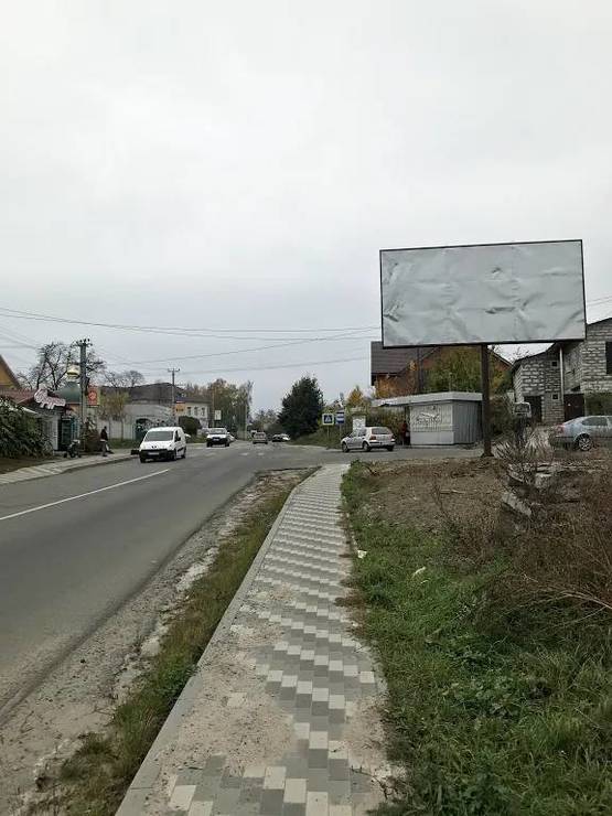 Фото рекламной плоскости по адресу Гатное , Ул. Жулянская , перекресток с Ул. Жовтнева