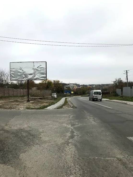 Фото рекламной плоскости по адресу Гатное , Ул. Жулянская , перекресток с Ул. Жовтнева