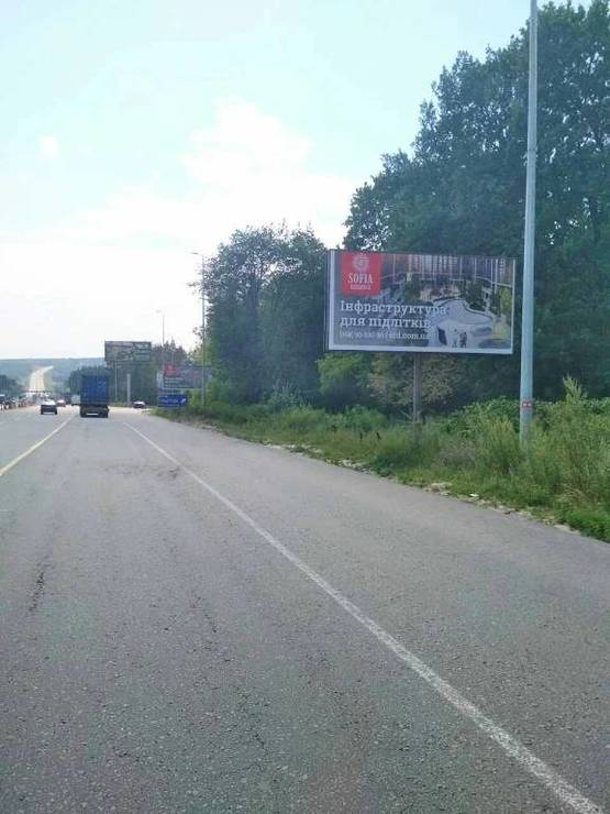 Фото рекламной плоскости по адресу В.Почтовая, а/д М-05 Киев-Одесса, за заправкой WOG