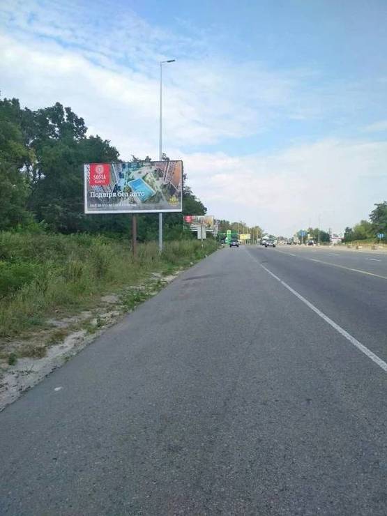 Фото рекламной плоскости по адресу В.Почтовая, а/д М-05 Киев-Одесса, за заправкой WOG