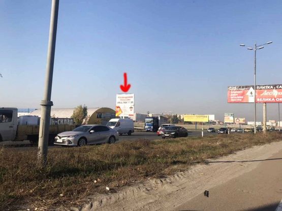 Фото рекламної площини за адресою Софиевская Борщаговка, Кольцевая дорога,на пересечении с ул.Яна Качуры перед выездом на Жулянский мост