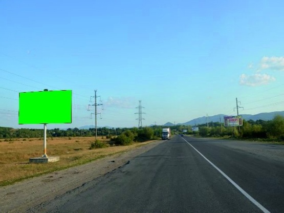 Фото рекламной плоскости по адресу м.Хуст обїзна дорога, в сторону м.Тячів,м.Рахів, трасса Мукачево- Рогатин (біля ринку)