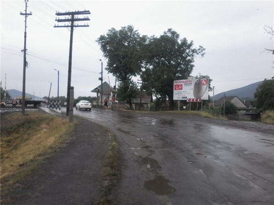 Фото рекламной плоскости по адресу м.Хуст, вул. Волошина, (переїзд) виїзд з міста траса  Івано-Франківськ-Мукачево, в сторону м. Мукачево