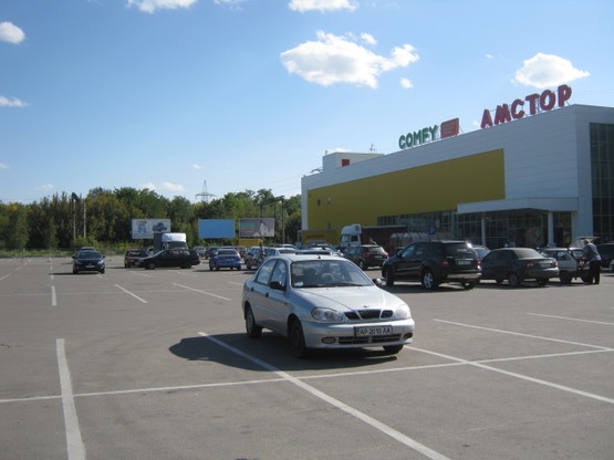 Фото рекламной плоскости по адресу 168_Запорожье_ул Чаривная \ул Авраменко АМСТОР стоянка