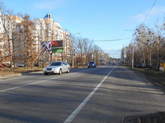 Фото рекламной плоскости по адресу м. Буча, траса М07, км 29+000 право, вул. Нове Шосе, 16, напрямок до Новусу, ЕКО Маркету