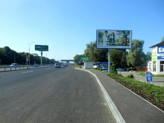 Фото рекламной плоскости по адресу Дніпровське шосе, поворот на с. Лісники, траса Н-01 "Київ-Знам'янка", км 20+850 право, біля "АТБ"