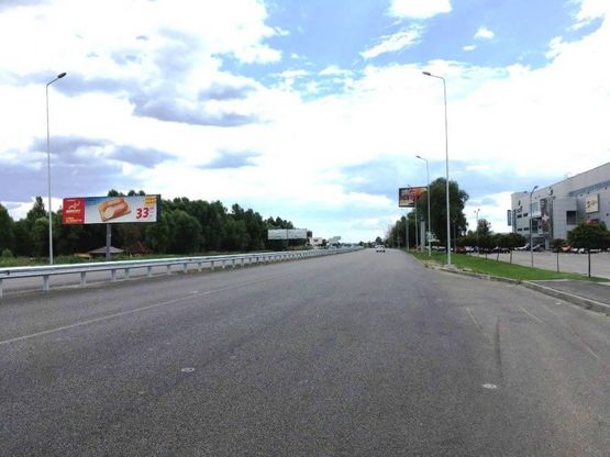 Фото рекламної площини за адресою Дніпровське шосе, поворот на с. Ходосеевка, напротив ТРЦ "Мегамаркет в Ходосіївці", "Киев-Обухов", км 23+850 лево