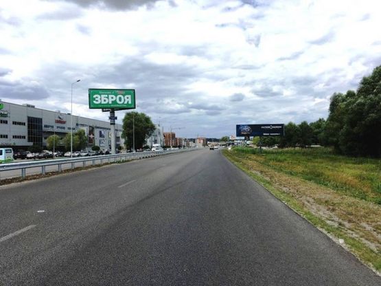 Фото рекламної площини за адресою Дніпровське шосе, поворот на с. Ходосеевка, напротив ТРЦ "Мегамаркет в Ходосіївці", "Киев-Обухов", км 24+050 лево