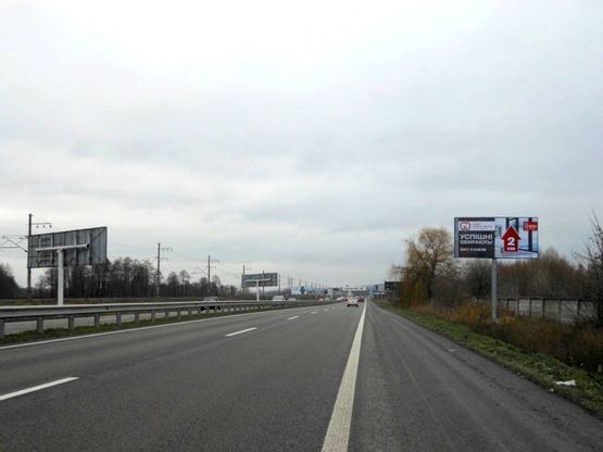 Фото рекламной плоскости по адресу Дніпровське шосе, траса Н-01 "Київ-Знам'янка", км 21+650 право