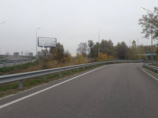 Фото рекламной плоскости по адресу м. Обухів, початок вул. Промислова, міст через трасу Н-01 Київ-Знамянка, на повороті на Київ