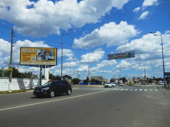 Фото рекламної площини за адресою м. Ірпінь , вул. Центральна,1, біля стели "Ірпінь", навпроти АЗК "ОККО"