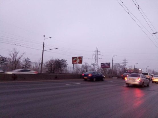 Фото рекламной плоскости по адресу Бандеры С. ул., 24б (напротив) 900 м. до моста "Северный"