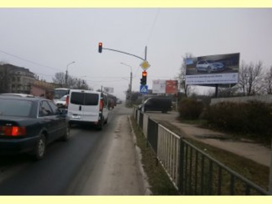 Фото рекламной плоскости по адресу Коновальця-Петлюри,напроти ОККО (ГМ "Велмарт")