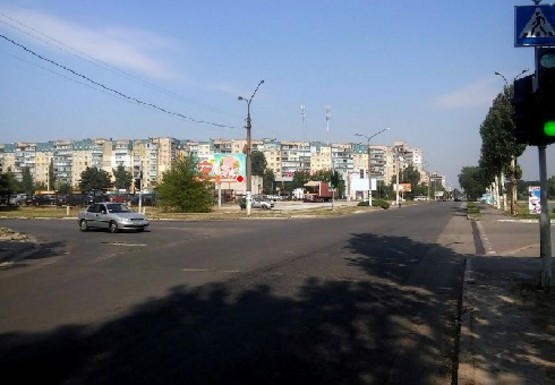 Фото рекламной плоскости по адресу Дружбы Народов пр. - Строителей (автостоянка)