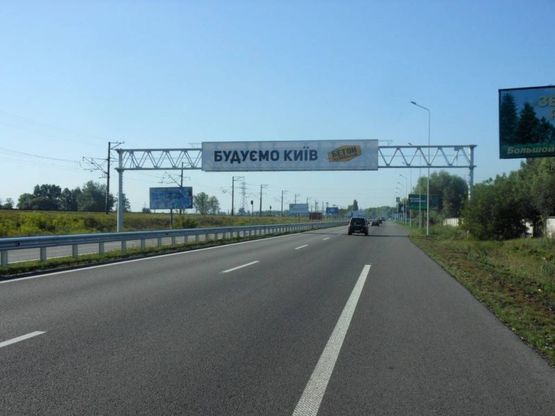 Фото рекламной плоскости по адресу Дніпровське шосе, територія під котеджну забудову, траса Н-01 "Київ-Знам'янка", км 22+200 ліво