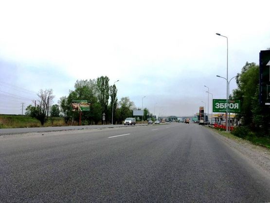 Фото рекламной плоскости по адресу Дніпровське шосе, км 23+300 лево,  перед поворотом на Ходосеевку, АЗС БРСМ, садовый центр "Интерфлора", МегаМаркет
