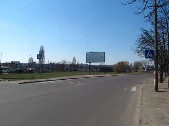 Фото рекламной плоскости по адресу Зодчих вул., 8, навпроти