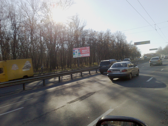 Фото рекламной плоскости по адресу ул. Телиги, напротив 43, направление на Шулявку