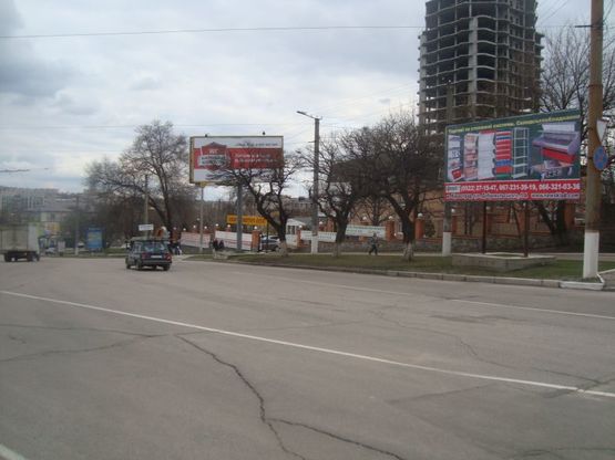 Фото рекламной плоскости по адресу ул. К. Маркса,65 (возле б-цы Св. Луки)