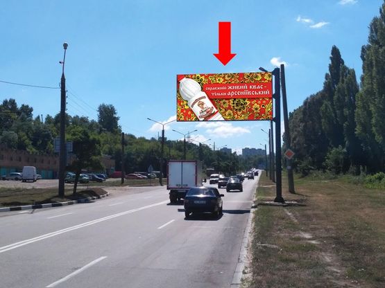 Фото рекламної площини за адресою Тракторостроителей пр., возле гаражного кооператива, в сторону ХТЗ