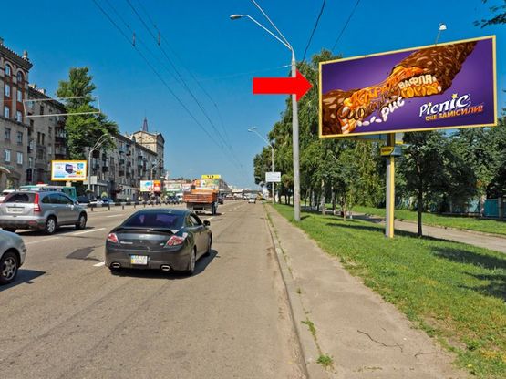 Фото рекламной плоскости по адресу Победы пр., 44-А, киностудия им. Довженко, напротив супермаркет "Эльдорадо", "Сильпо", из центра